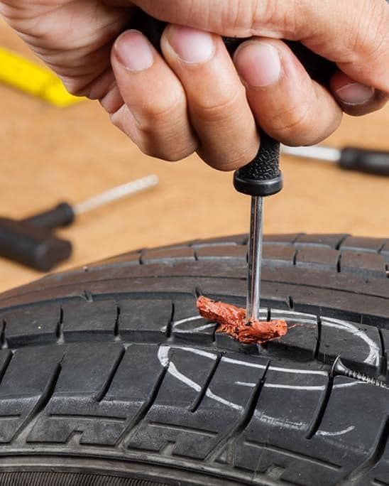 Flat tire roadside assistance and spare tire installation