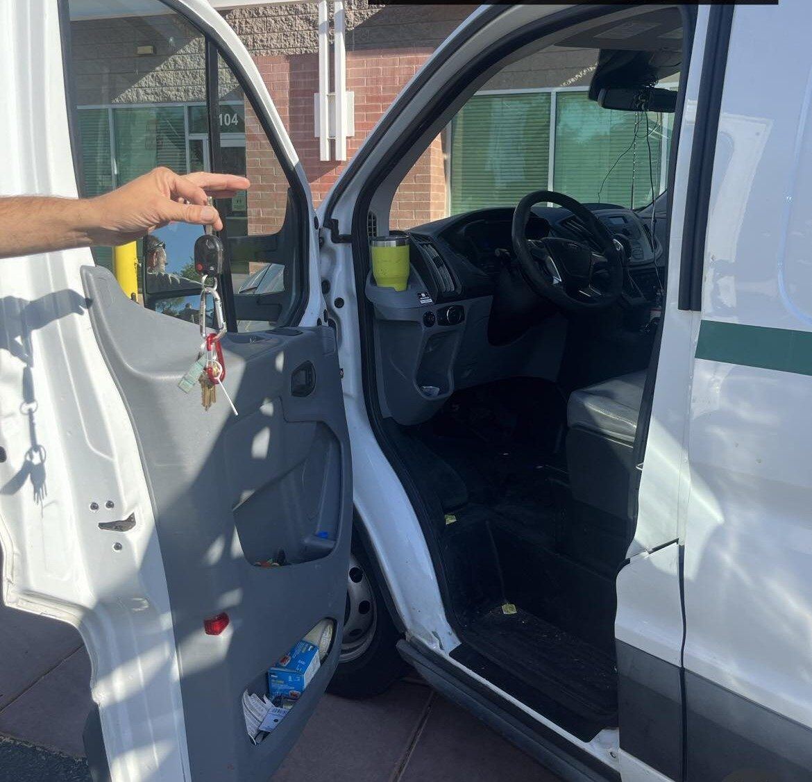 Precision Roadside Service roadside lockout technician opening a vehicle